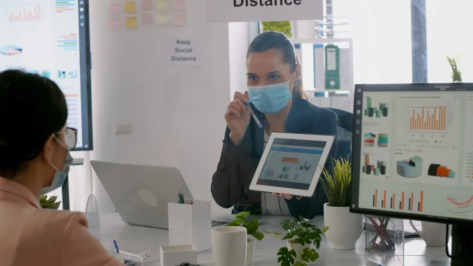 Office meeting with tablet