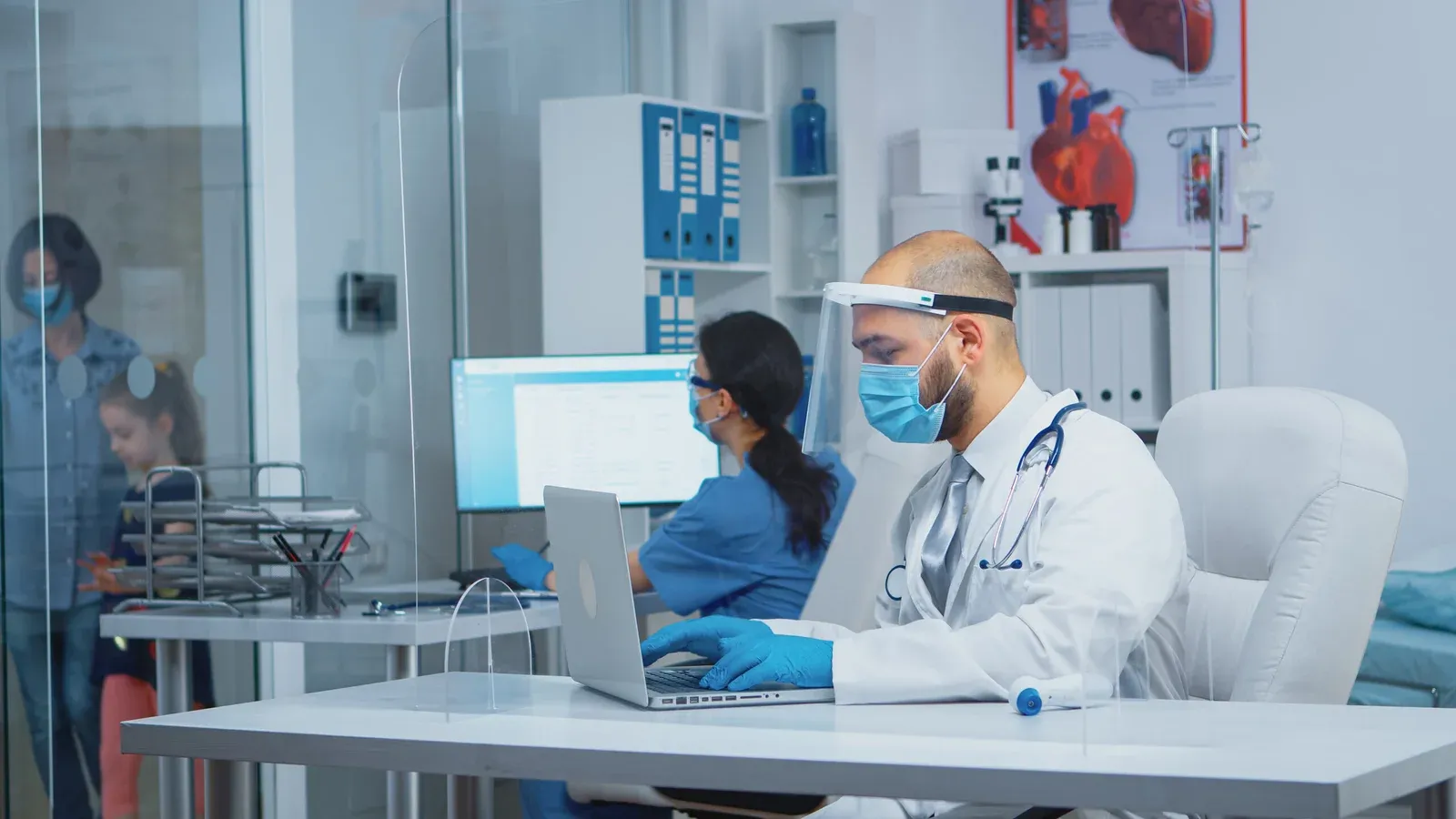 Doctor working on laptop