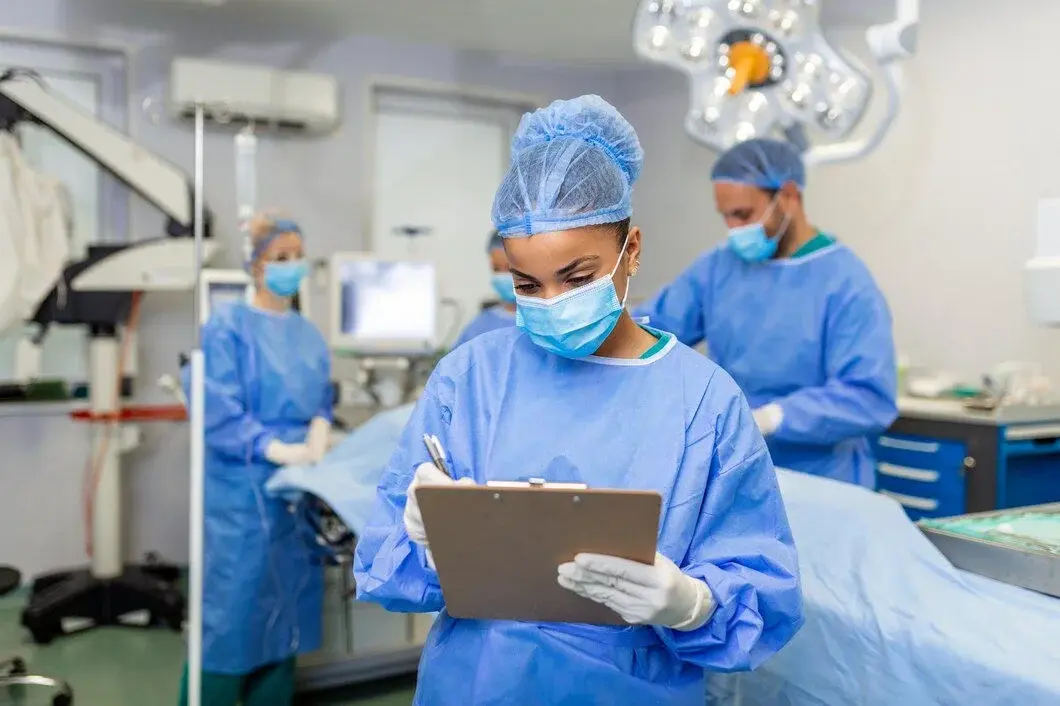 Surgeons checking surgical records