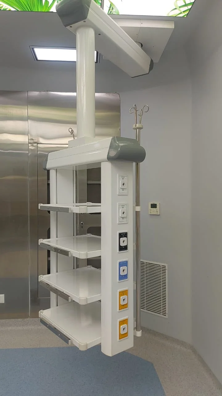 Single-arm OT pendant with medical gas outlets and shelves by Gaddiel